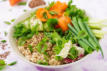 Diet menu. Healthy lifestyle. Oat porridge and fresh vegetables - celery, spinach, cucumber,  carrot and onion  on plate.