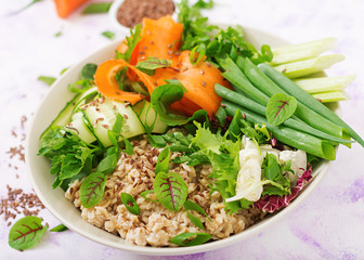 Diet menu. Healthy lifestyle. Oat porridge and fresh vegetables - celery, spinach, cucumber,  carrot and onion  on plate.