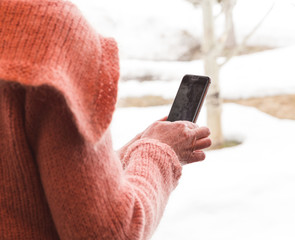 Mature Woman Using Phone Outside