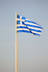 Fototapeta premium Greek flag floating on a white mat