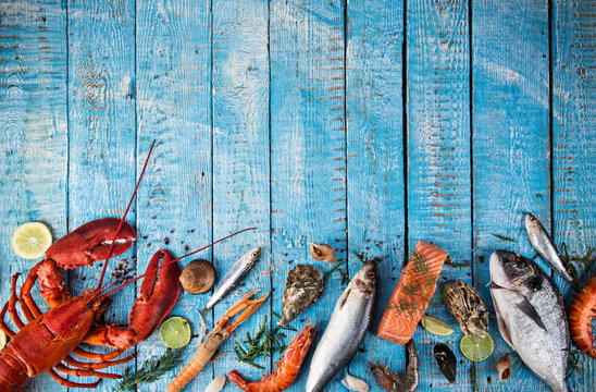 Fresh tasty seafood served on old wooden table.