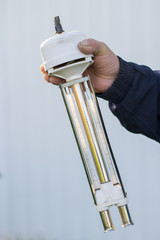 The hand holds the measuring device for weather forecasting. weather forecast