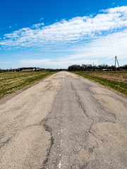 forest road with sun rays in the morning