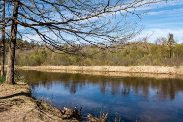 Fototapeta na wymiar scenic spring colored river in country