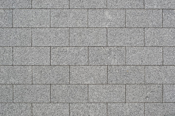The texture of a wall of granite blocks