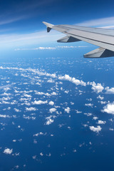 Fototapeta premium Above the clouds.Wing aircraft on the sky