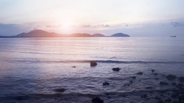 Motion of water wave in the sea landscape nature and bech sand with sky in morning light