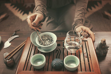 young beautiful blonde woman making tea ceremony