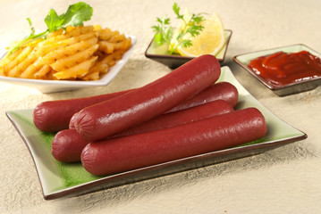 Beef Sausage franks with lemon and bell peppers with ketchup