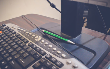 keyboard on wooden table at office, business concept