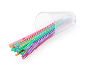 Colorful drinking straws in glass