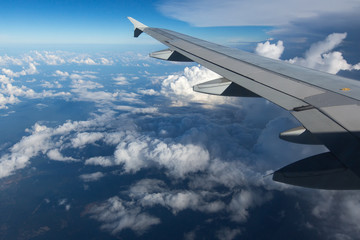   Above the clouds.Wing aircraft on the sky