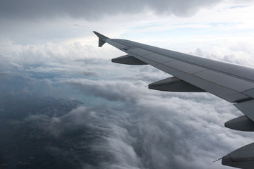   Above the clouds.Wing aircraft on the sky