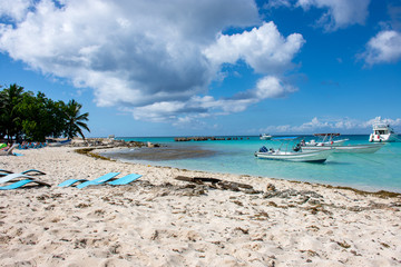 Speed Boats in the clear ocean on a background of palm trees and beautiful clouds.