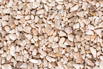 Dark beige fine pebbles texture.