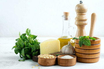 Ingredients for pesto on a white background.