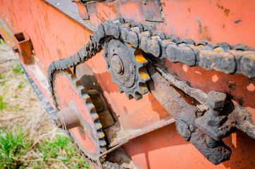 Old rusty species of part of agricultural machinery in rural areas. - obrazy, fototapety, plakaty