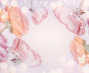 Pastel pink floral background with bokeh , frame. Festive greeting card.