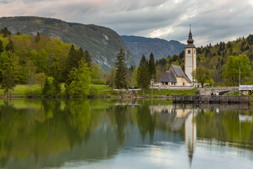 Fototapeta na wymiar John the Baptist's Church at Lake Bohinj near Bled in Triglav National Park, Julian Alps, Slovenia 