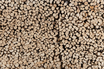 Natural wooden background, closeup of chopped firewood