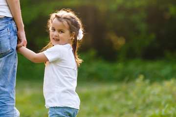 Adorable little girl holding her father hand
