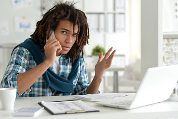 Young business man with laptop working 