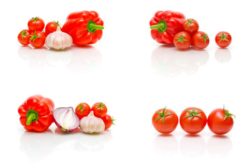 Cherry tomatoes, garlic and onions on a white background