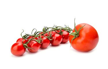 Branch of ripe cherry tomatoes over the white background