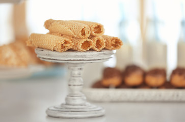 Rolls with condensed milk on dessert stand