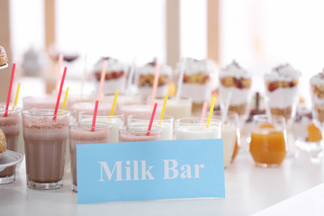 Glasses with different drinks in milk bar