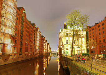City canal in warehouse district at night, Hamburg, Germany