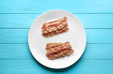 Fried bacon slices on plate