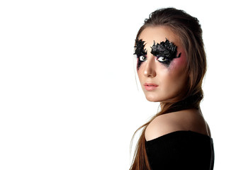 Girl with paper zigzag make-up and brown hair.Creative makeup.White background.Copy space