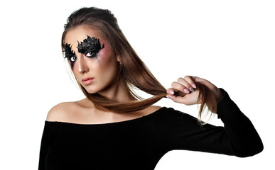 Girl close eyes with paper zigzag make-up and brown hair.Hold hair in hand.Creative makeup.Red...