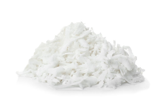 Heap of coconut flakes on white background