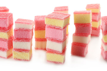 Tasty jelly candies on white background