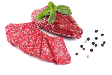 Salami smoked sausage with slices and mint leaves isolated on white background cutout