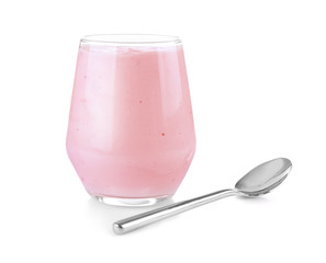 Glass of tasty yogurt and spoon on white background