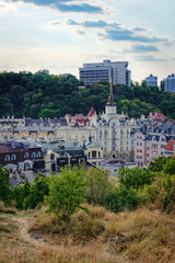 Fototapeta na wymiar Views of modern and ancient buildings from the Castle hill or Zamkova Hora in Kiev, Ukraine. Castle hill is a historical landmark in the center of the city.