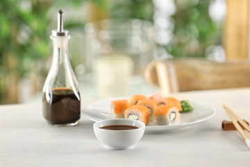 Composition with tasty soy sauce on table