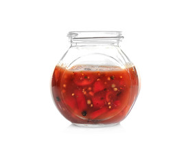 Jar with tasty chili sauce on white background