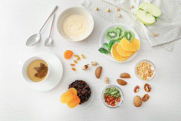 Composition with tasty yogurt on kitchen table
