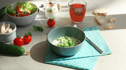 Composition with tasty yogurt on kitchen table