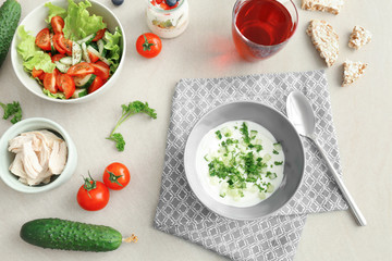 Composition with tasty yogurt on kitchen table