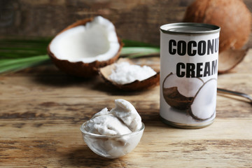 Coconut cream in bowl on wooden background