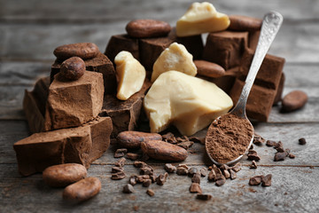Composition of cocoa products on wooden background