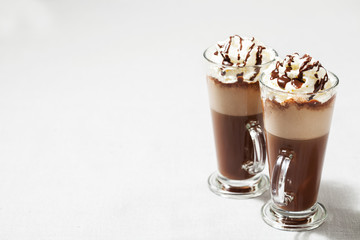 Refreshing iced coffee drink with whipped cream: freddoccino, frappuccino

