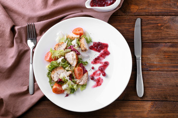 Portion of salad and cranberry sauce on plate