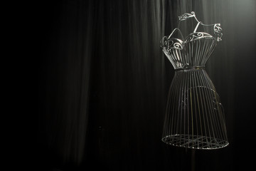 Iron the dress on a black background