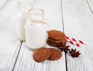 oatmeal cookies and bottles of milk